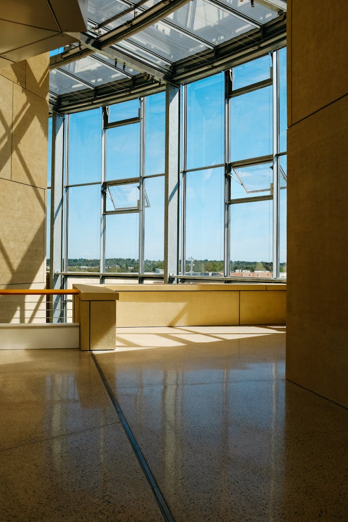 Contemporary architectural space with large windows and ample natural sunlight.